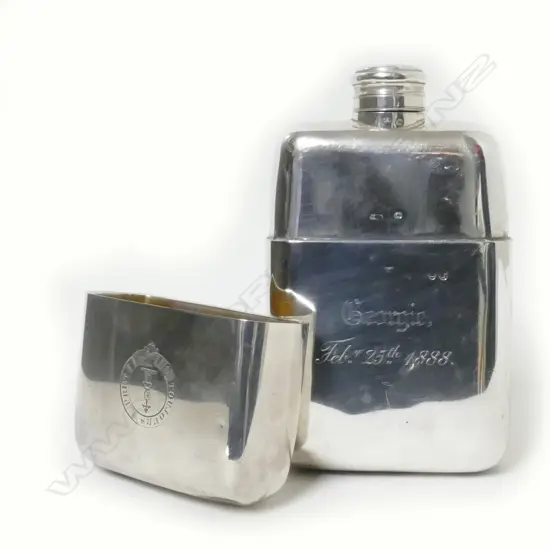 A Victorian silver hip flask with integral cup