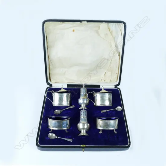 An early 1900s silver condiment set