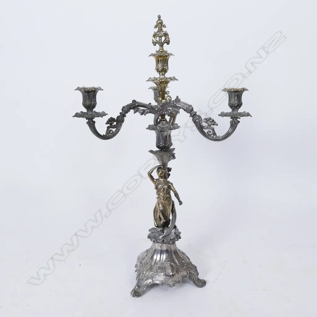 An ornate silver plate and parcel gilt candelabra Image 1++