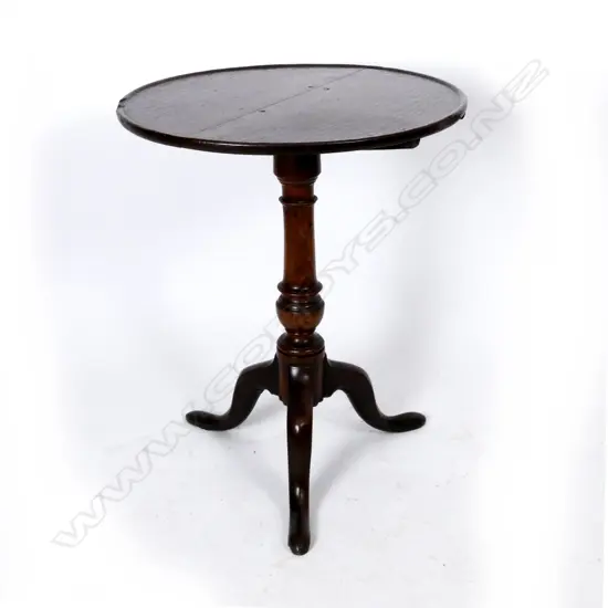A Georgian oak tilt-top wine table