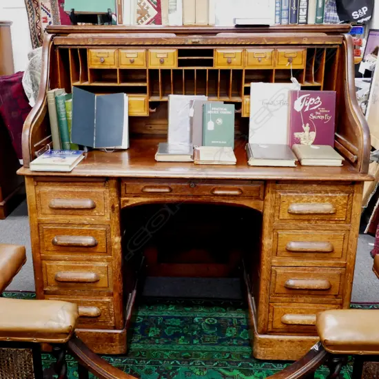 A 1920's oak roll-top desk