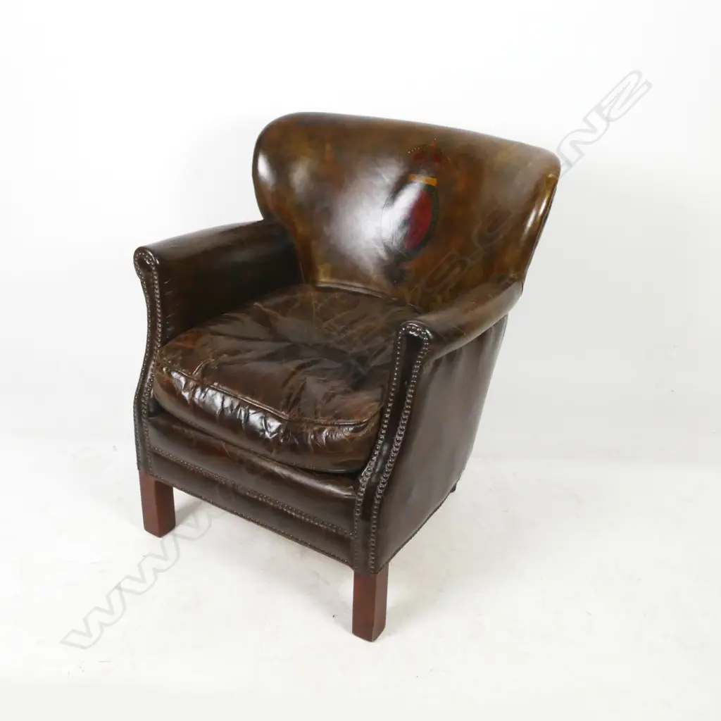 A vintage leather club chair Image 1++