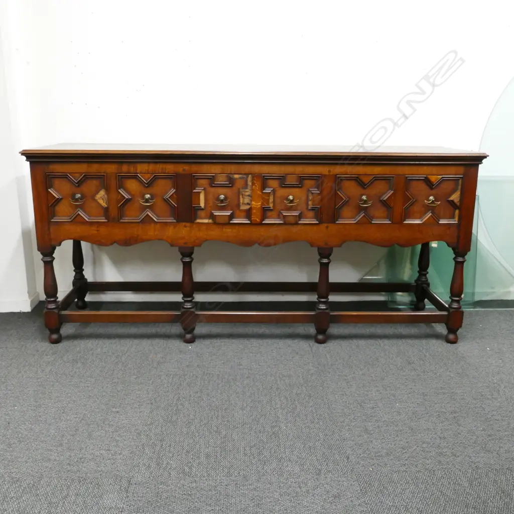 A Jacobean style oak three drawer dresser base Image 1++