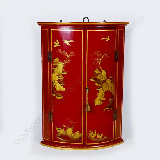 A Georgian chinoiserie corner cabinet