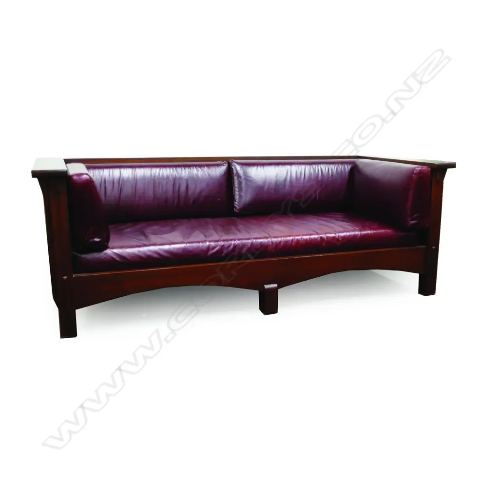 A mahogany American Arts & Crafts 'Mission Revival' style three seater sofa Image 1++
