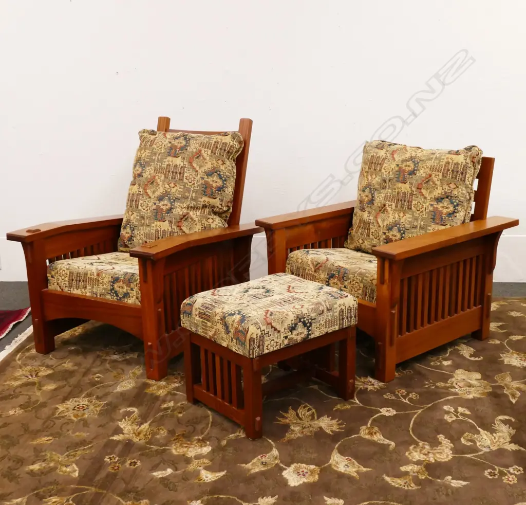 A pair of mahogany American Arts and Crafts 'Mission Revival' style armchairs and an ottoman Image 1++