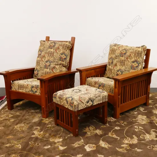 A pair of mahogany American Arts and Crafts 'Mission Revival' style armchairs and an ottoman