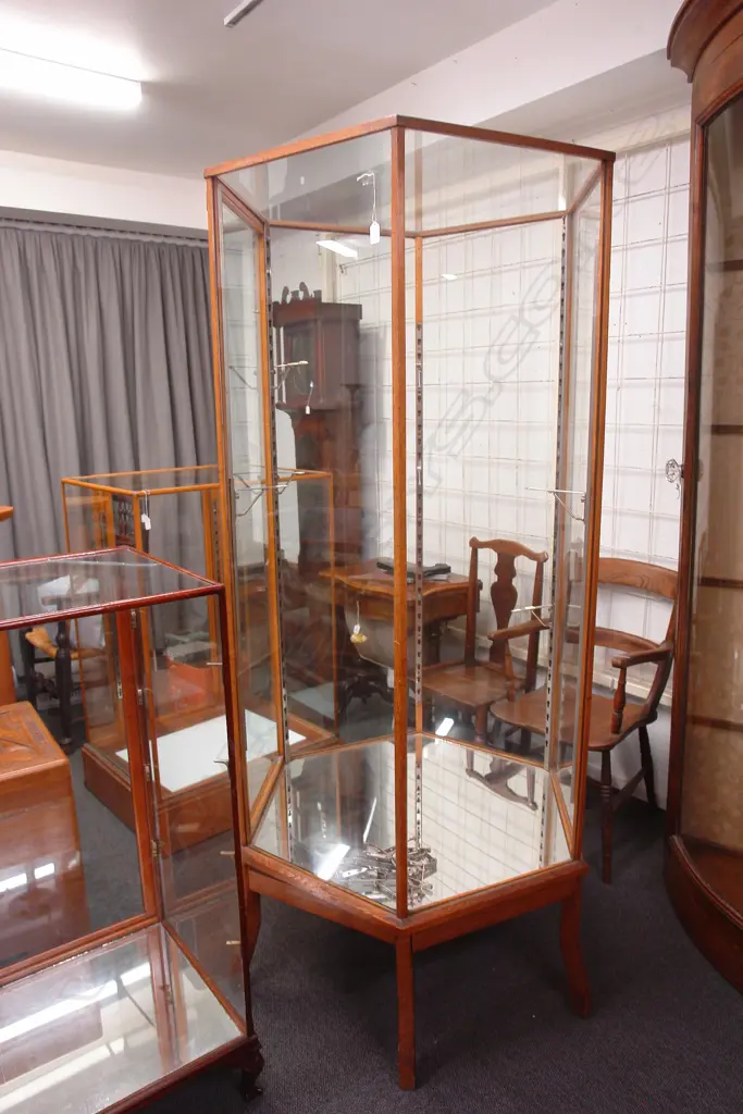 A 1920/1930s rare tall hexagonal oak framed and glazed shop display cabinet Image 1++
