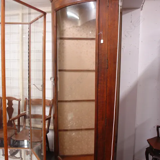An uncommon Victorian tall oak corner fitting shop display cabinet