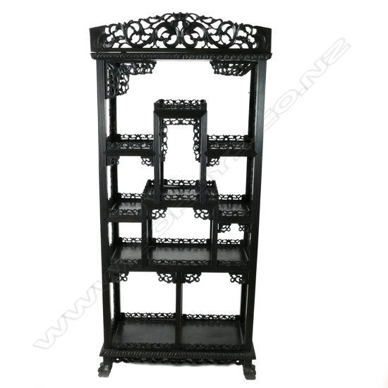 A vintage Chinese black wood display shelf