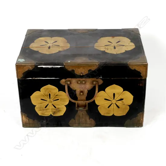 An old wood and lacquer Japanese travelling trunk