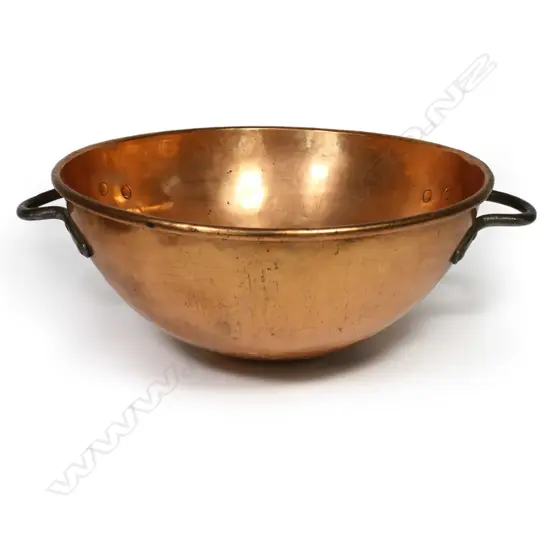 An impressive large antique copper bowl,