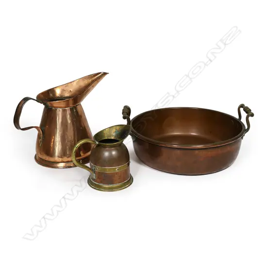An antique copper pan and harvest jug,
