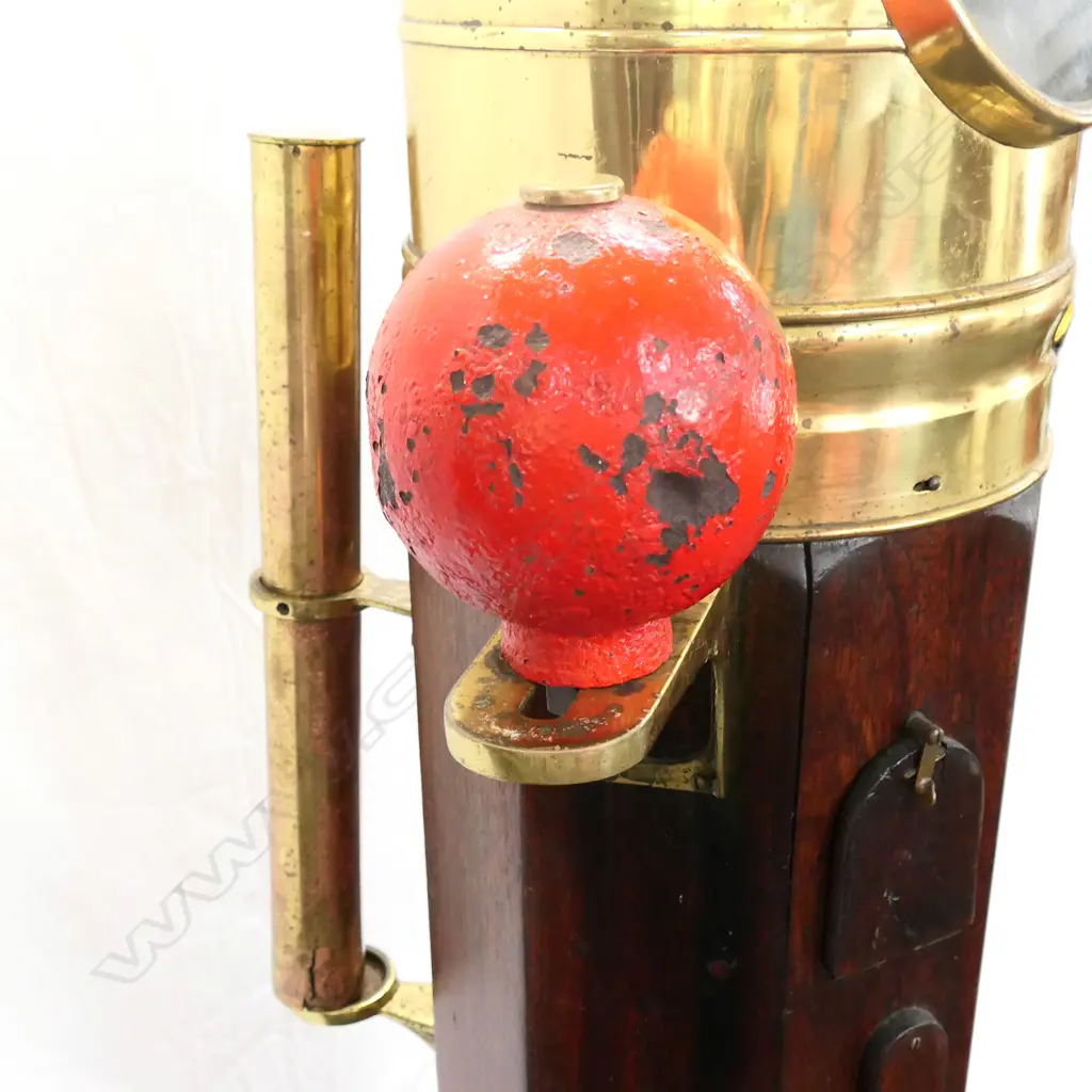 A ship's binnacle compass, octagonal teak case on square plinth base, with brass glazed dome and fittings, flanked by red and green painted steel balls, the Hartmann, Hamburg compass with Lilley & Reynolds, London card. H.1500mm. Image 1++