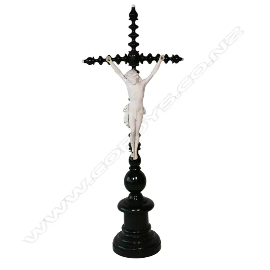A vintage wood and porcelain crucifix,