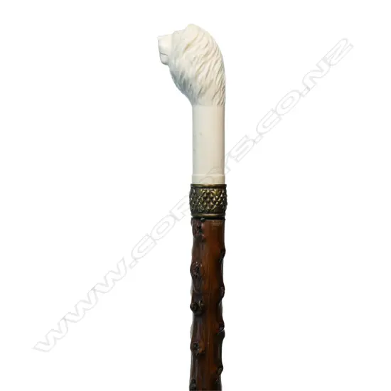 An ivory handled briar walking stick,