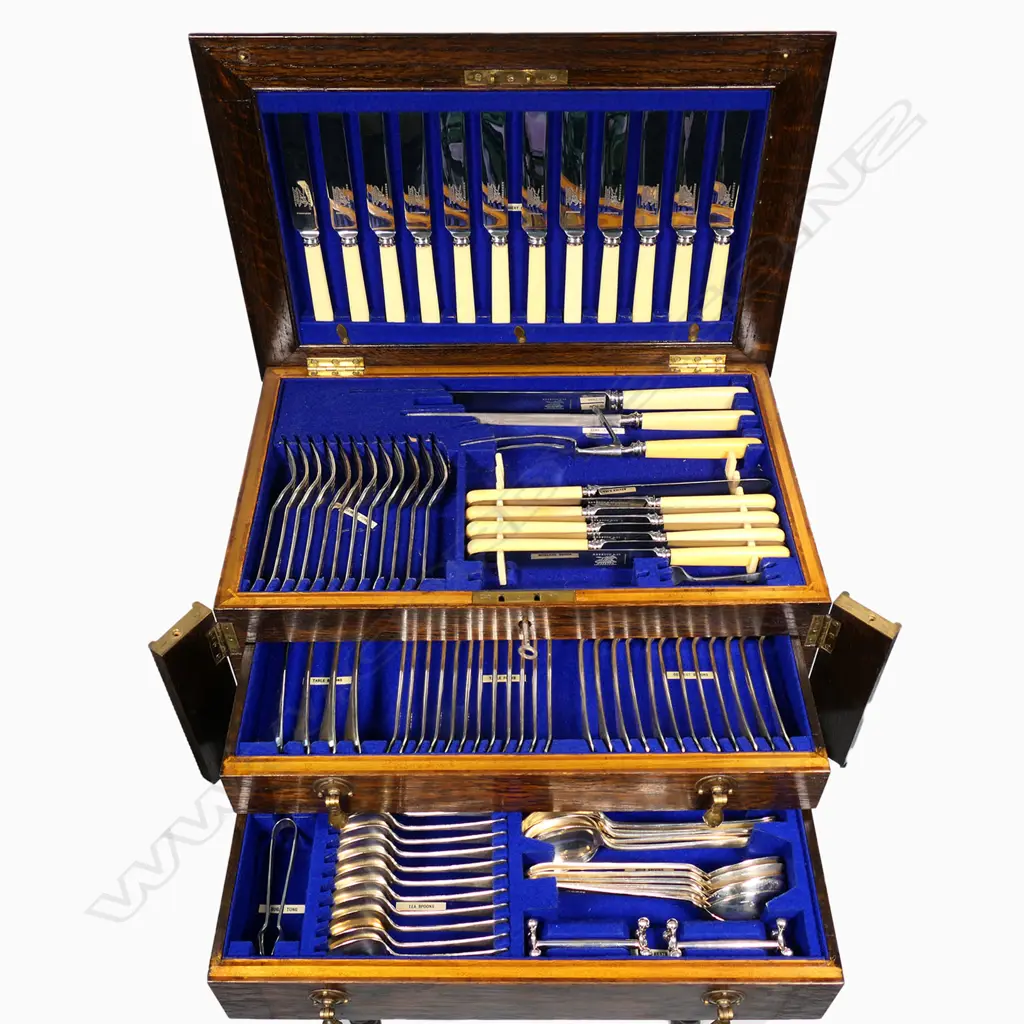 A twelve-place silver plate cutlery set in oak stand, Image 1++