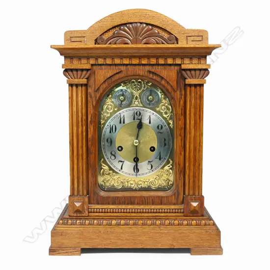 An Edwardian oak cased mantel clock,