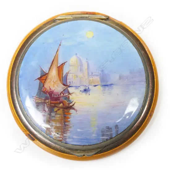 An early 20thC silver and scenic enamel powder compact,