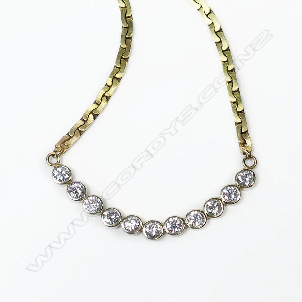 An 18ct and 9ct yellow gold and diamond necklace, Image 1++