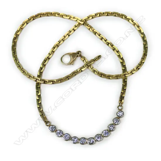 An 18ct and 9ct yellow gold and diamond necklace,