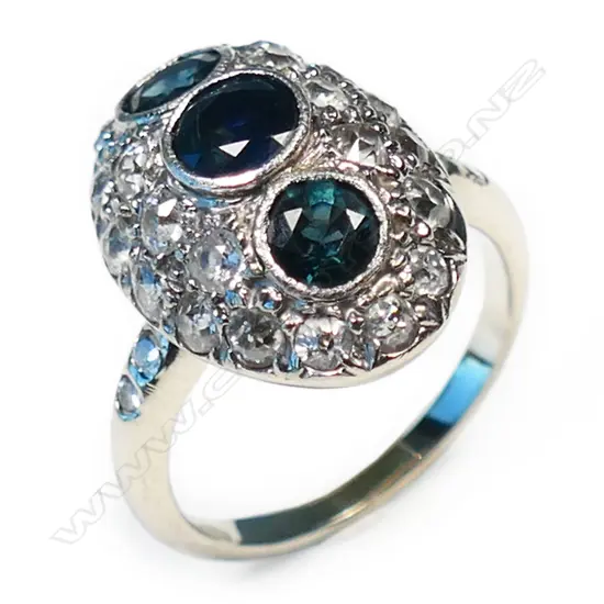 A 14ct white gold dome top sapphire and diamond ring,