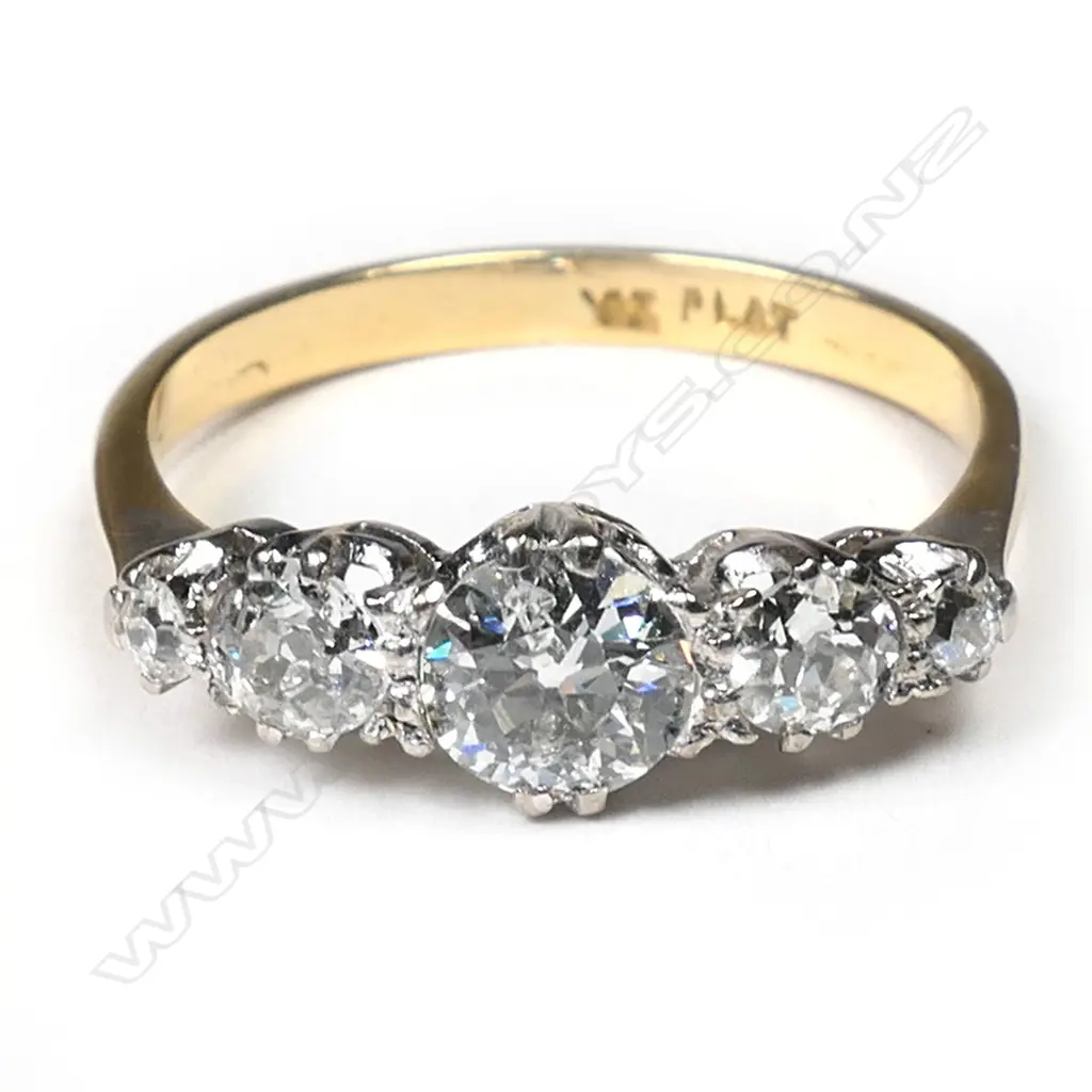 A platinum and yellow gold multi diamond ring, Image 1++