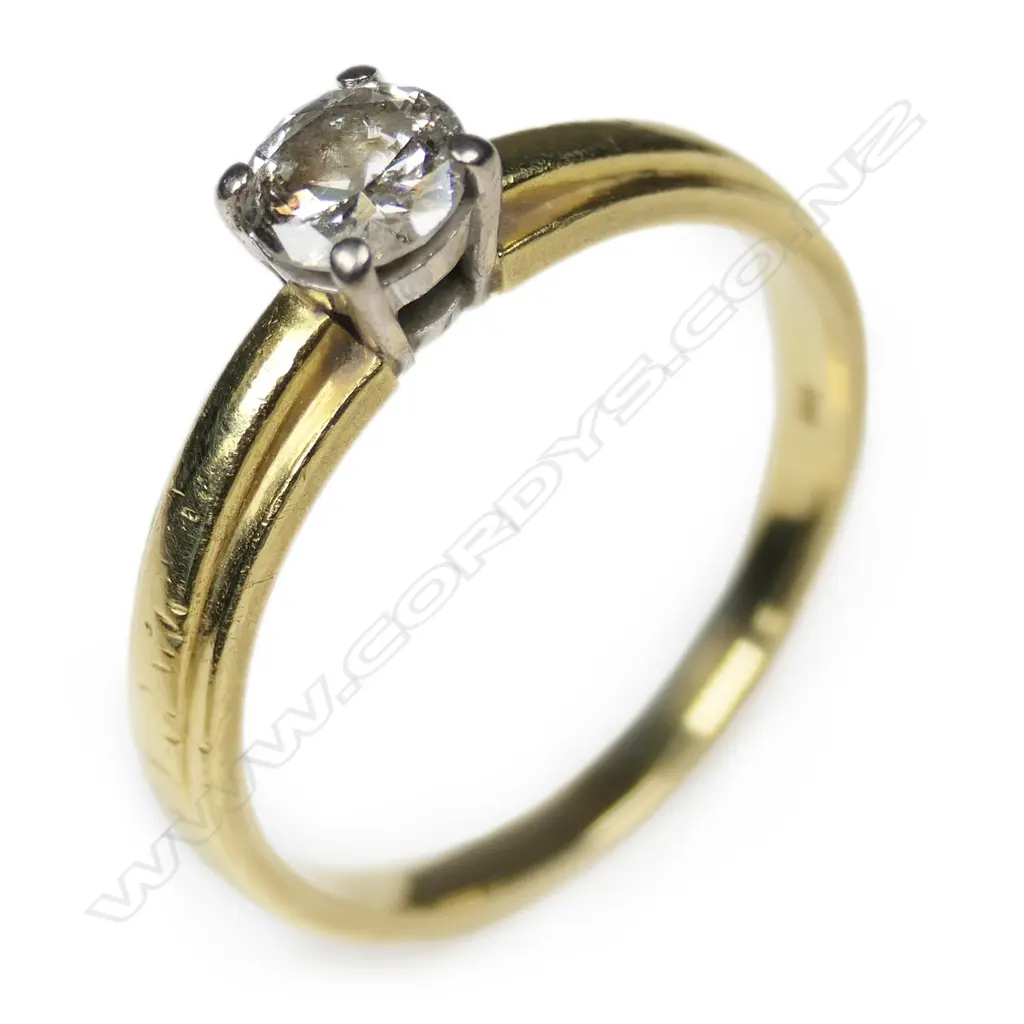 An 18ct gold and diamond solitaire ring, Image 1++