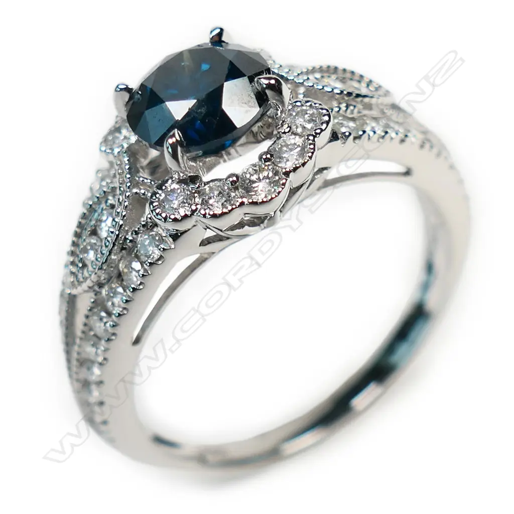 A 14ct gold and diamond halo ring, Image 1++
