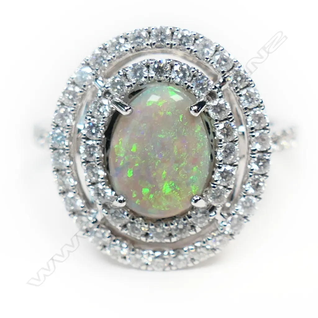 A 14ct white gold opal and diamond double halo ring, Image 1++