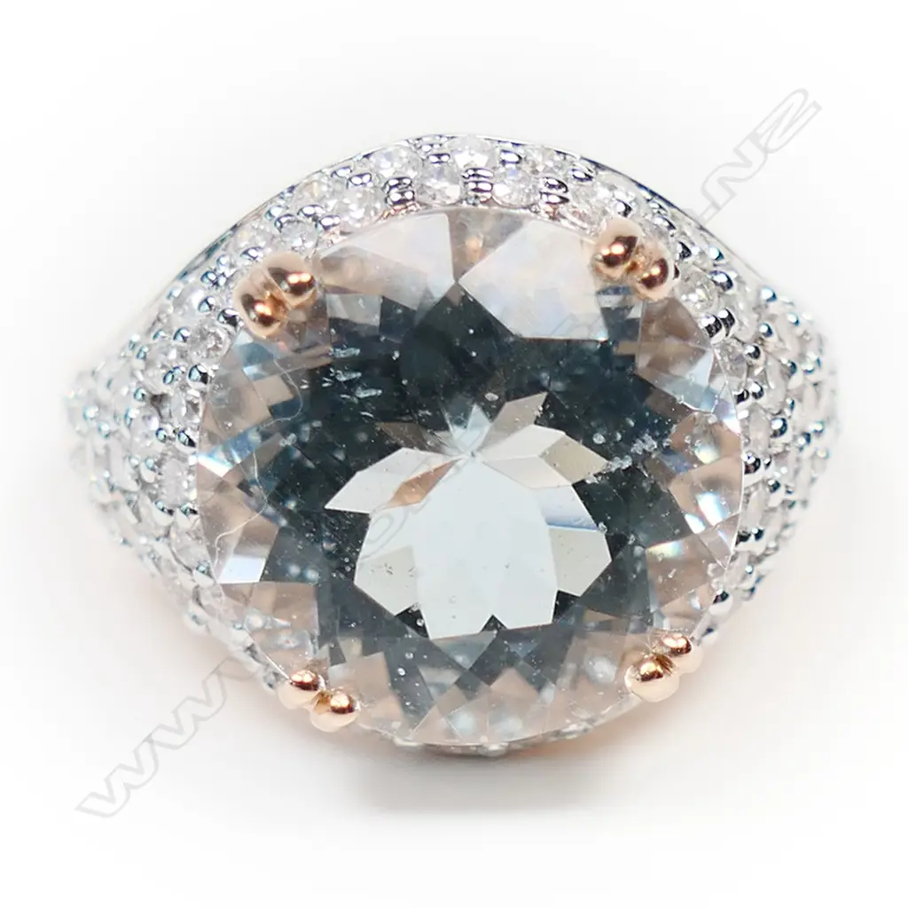 A 14ct rose gold aquamarine and diamond cluster ring, Image 1++