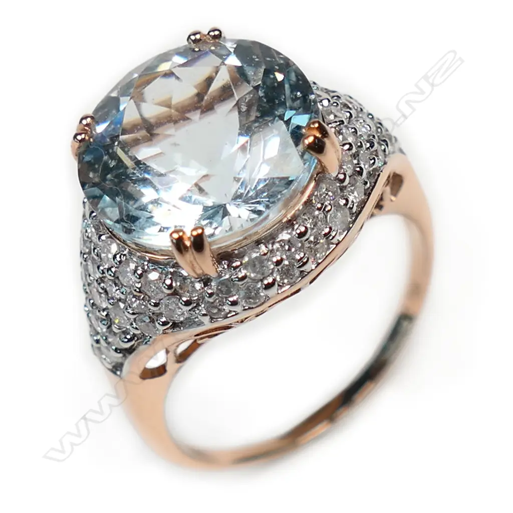 A 14ct rose gold aquamarine and diamond cluster ring, Image 1++