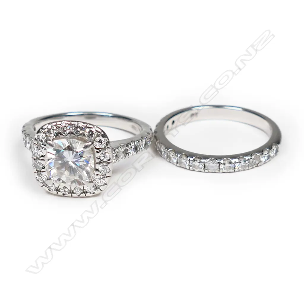 A pair of platinum and moissanite rings, Image 1++
