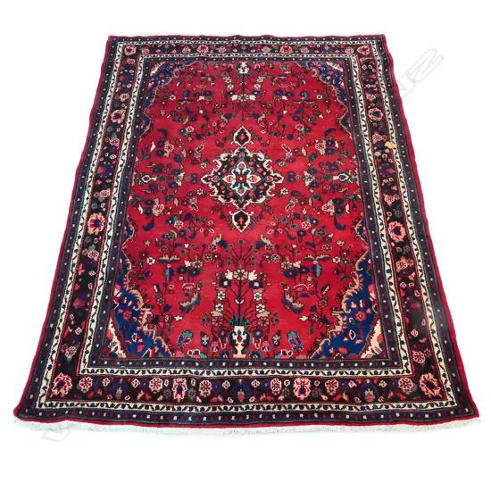 A hand-knotted wool pile Hamadan rug,
