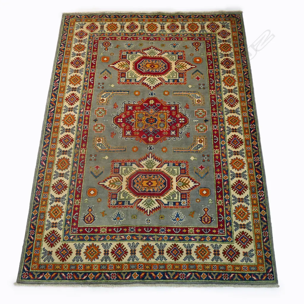 An Afghan Kazak hand knotted wool pile rug, Image 1++