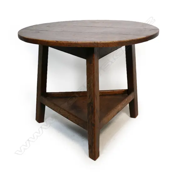 A 19thC oak cricket table, three plank top,