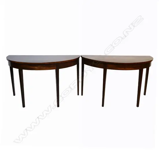 A pair of Victorian mahogany demi-lune tables,