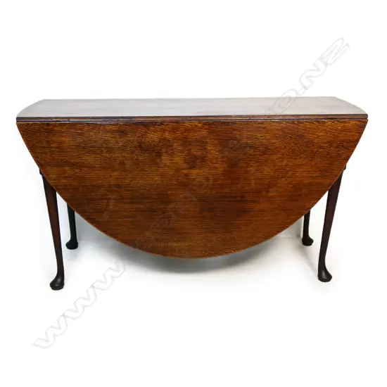 A Georgian oak drop leaf table,