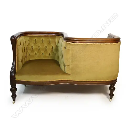 A Victorian mahogany conversation sofa,
