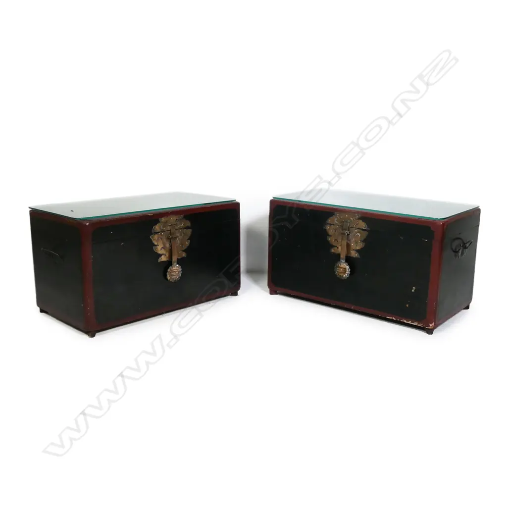 A near pair of Korean wedding chests, in black and maroon lacquer, oblong, with later glass tops to serve as occasional tables, largest 660 x 340 x 370mm. Image 1++