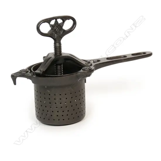 (A c.1900 cast iron fruit press