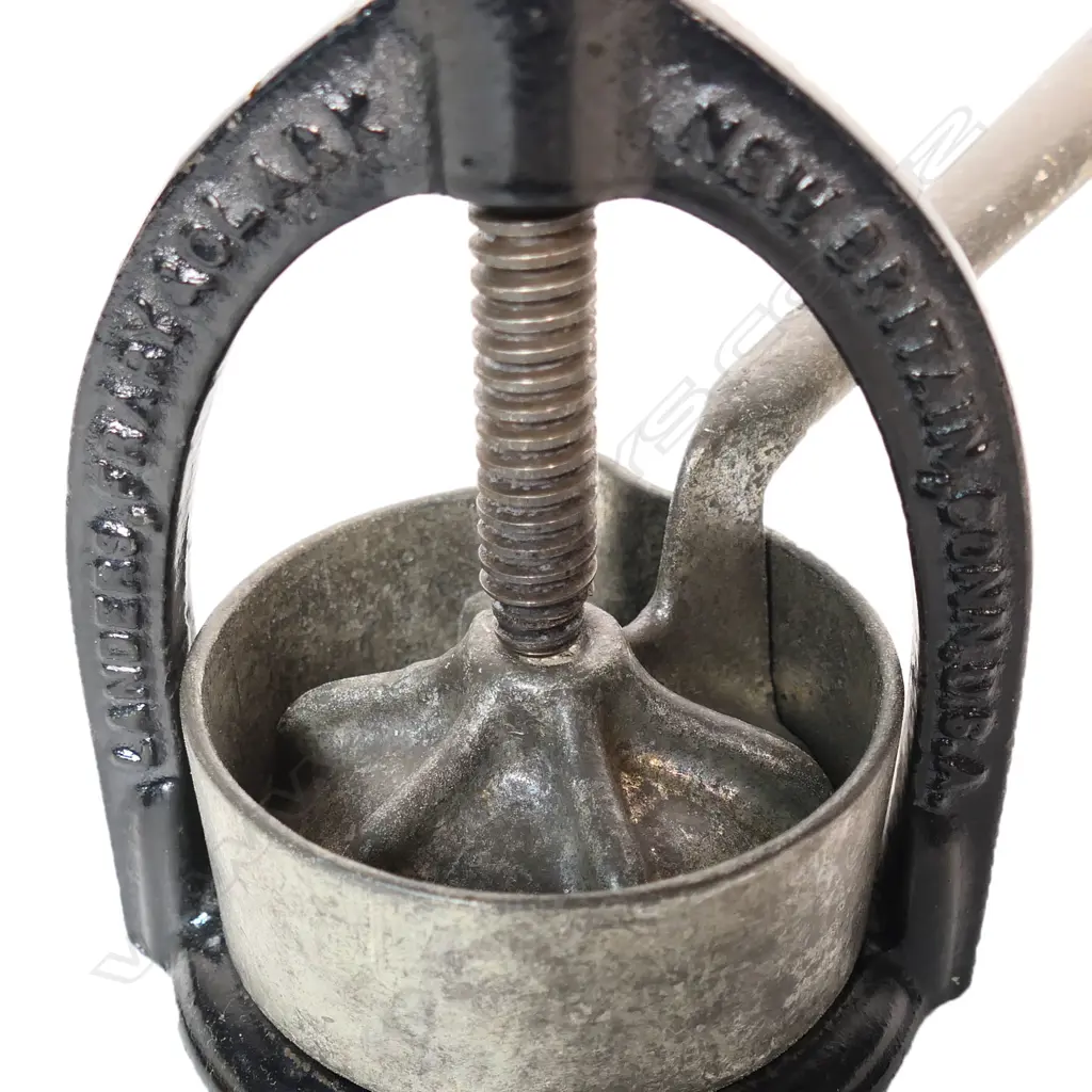 An 1884 Landers Frary & Clark USA meat and juice juice press, Image 1++