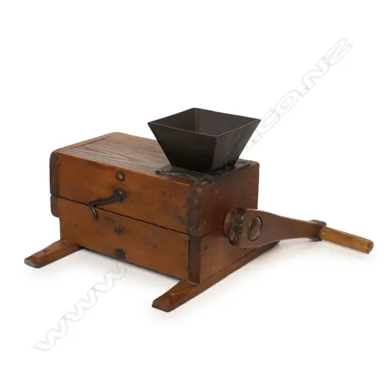 A c.1840-58 American heavy oak construction meat grinder,