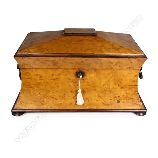 A Regency birds eye maple sarcophagus form jewel box,