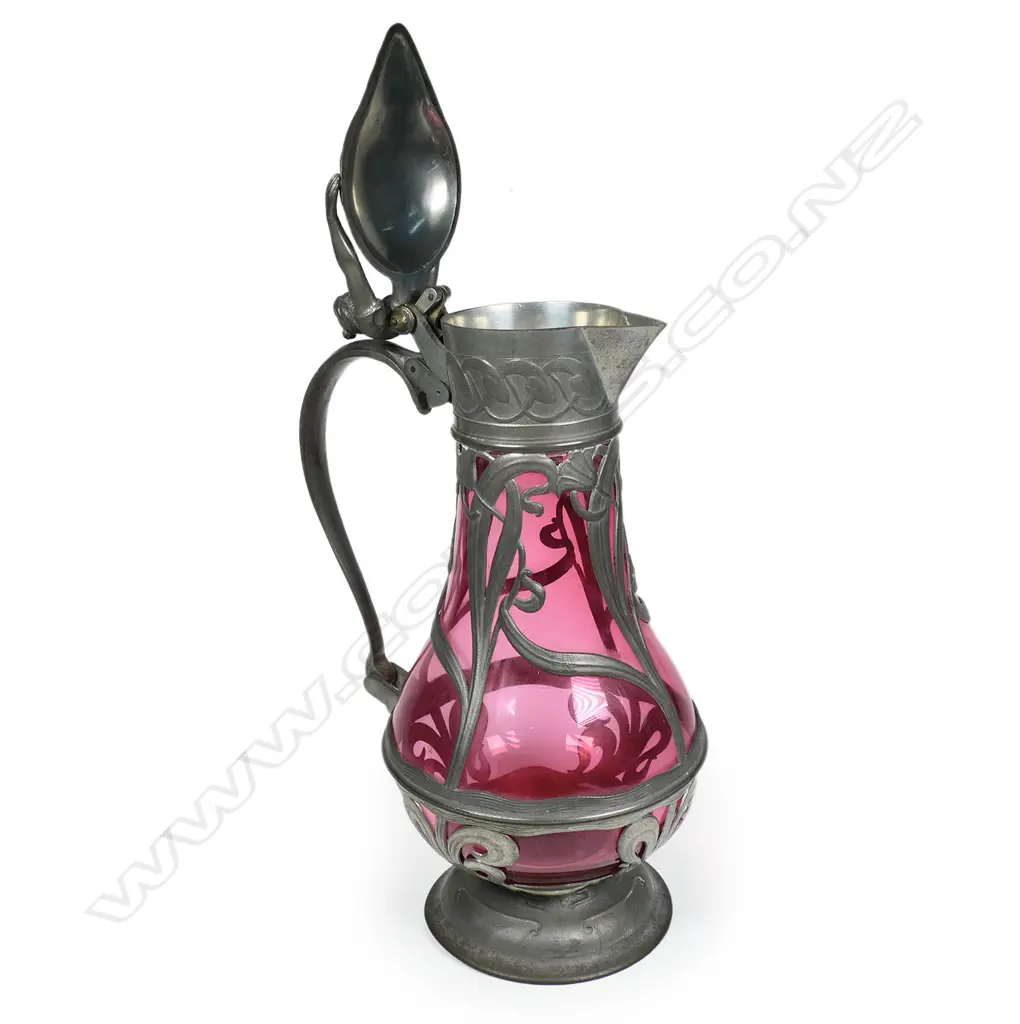 A European Art Nouveau pewter and cranberry glass wine carafe, Image 1++