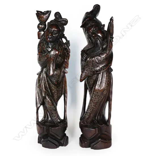 A pair of old oriental carved hardwood figures,