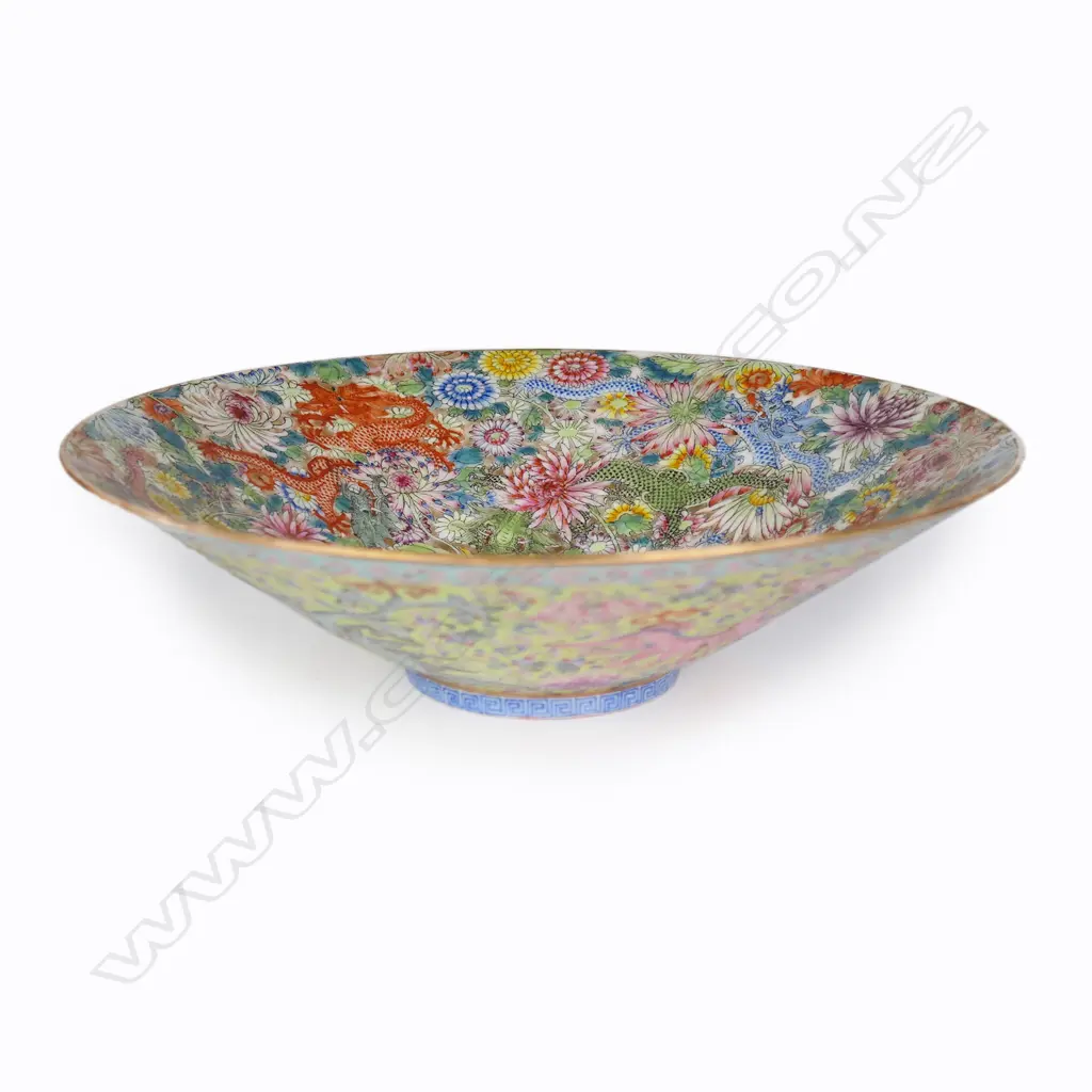 A fine quality Chinese all over floral enamelled dish - flared form, the fine floral (100 flowers) decoration incorporating green and red dragons. Four-character Qianlong mark in kaishu script in blue enamel to the base. Dia.207mm. Purchased Webb's 23.07.23 $9,560. Catalogued as Republic period. Image 1++