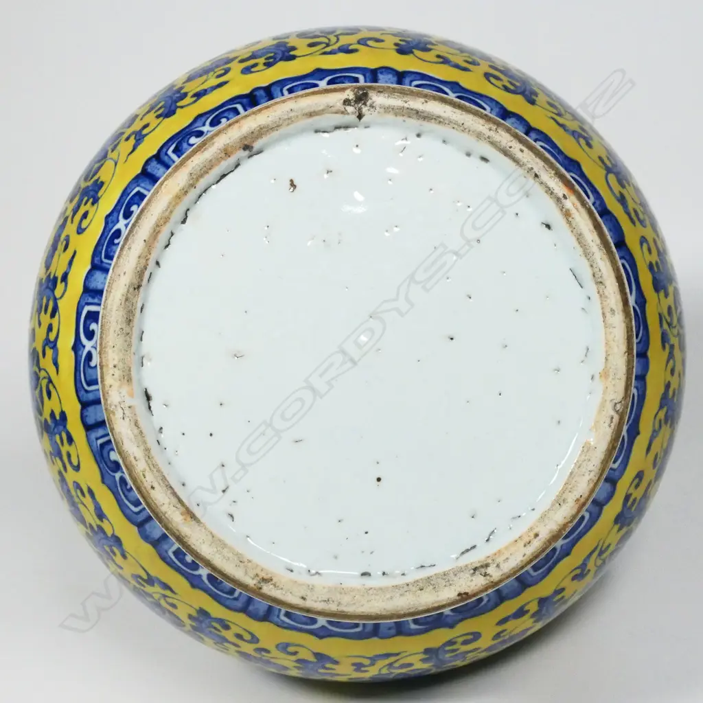 A large Chinese porcelain vase - round spreading foot, bulbous ovoid form, blue trailing flowering vines on a mustard yellow ground, shoulder handles in the form of mythical beast heads, glazed turquoise interior. H.370mm. Image 1++