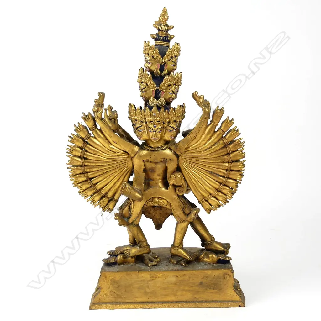 A Tibetan gilt bronze figure of a sixteen headed deity, Image 1++