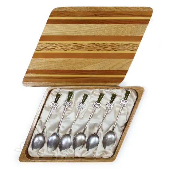 A set of six New Zealand Māori themed silver and pounamu coffee spoons,
